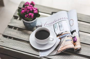 a book with a cup of coffee